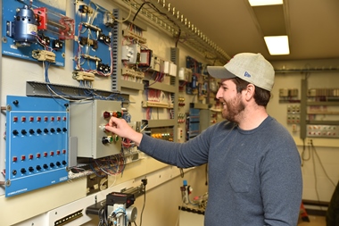 male student working in electrical technology room