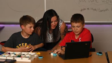 Early Childhood education teacher Emily Bertrand observing studies with the kids