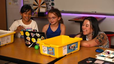 Early childhood education teacher Emily Bertrand teaching two kids