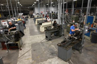 Machine tool classroom with rows of machinery lined up.