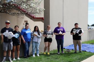 STEM club members doing an egg drop contest.