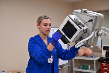 Radiography student in health simulation session