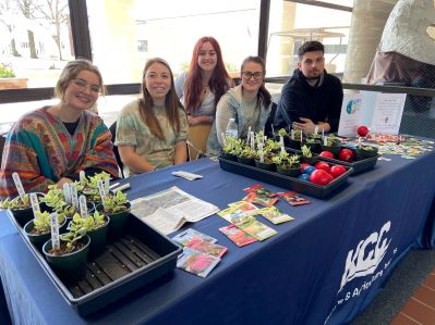 5 agriculture students with plants.