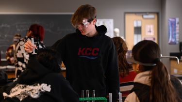 Biology student taking a sample