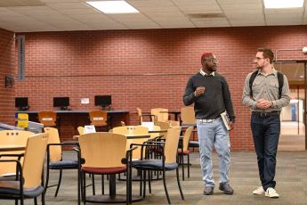 KCC students walking by Hammes Cafe.