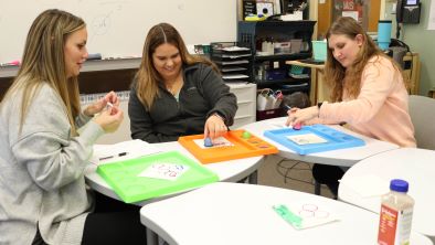 Early childhood students playing with playdoh