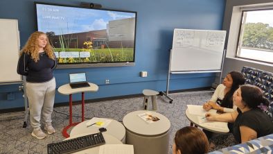 Elementary education students having a meeting in L355 which is The Commons room