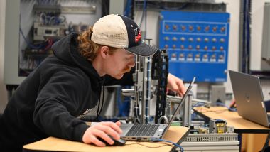 An electrical engineer student testing different technician tools