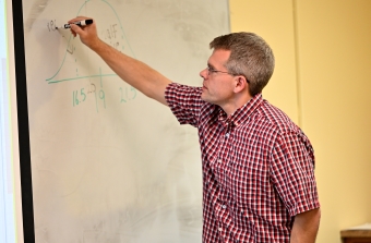 Statistics class - teacher at whiteboard
